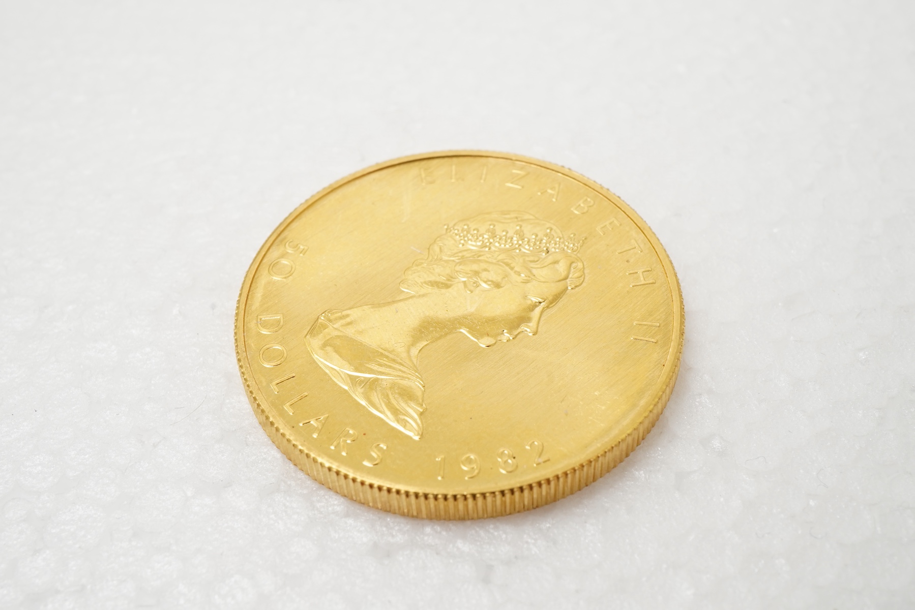 An Elizabeth II gold Canadian 50 dollar coin, 1982